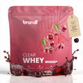 Brandl clear whey cherry splash proteinpulver im kräftigen pinken beutel mit kirschmotiven und spritz-design