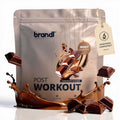 Brandl post-workout whey 2.0 schokoladenwunder proteinpulver in silberner tasche mit schokoriegel und spritzgrafik