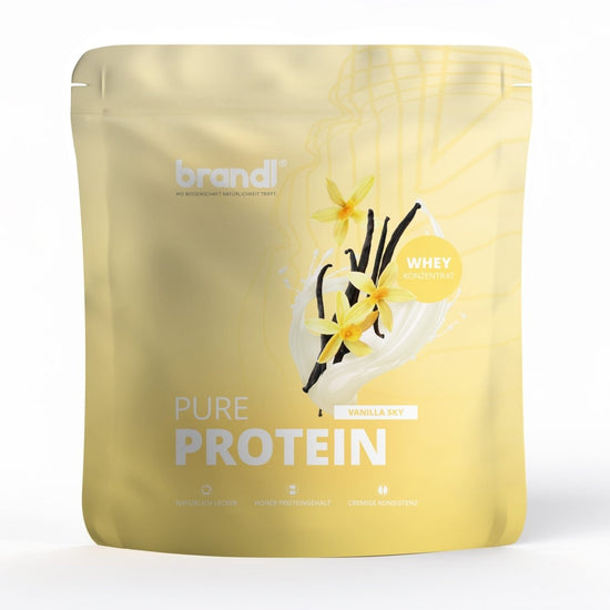 Eine gelbe pouch von brandl pure protein 2.0 whey in vanillegeschmack mit schwarzen vanilleschoten und gelben blumen