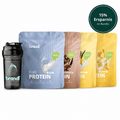 Schwarze brandl shaker flasche mit türkisem logo neben vier bunten veganen protein pouches im 3-er protein bundle vegan