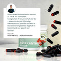 Weiße dose bio astaxanthin mit schwarzen und roten kapseln als hochwertiges antioxidans supplementation