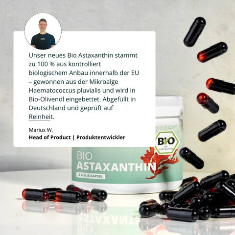Weiße dose bio astaxanthin mit schwarzen und roten kapseln als hochwertiges antioxidans supplementation