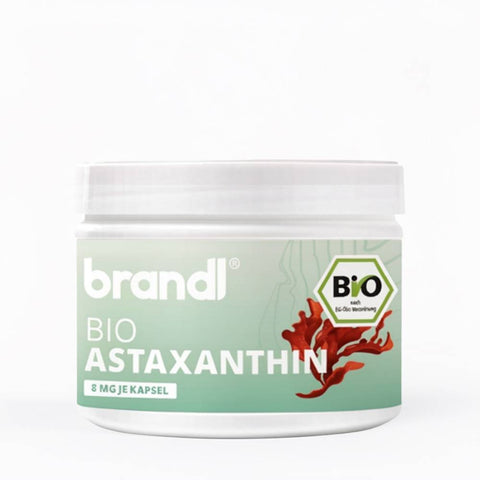 Brandl bio astaxanthin supplement in white jar with light green label featuring red seaweed and brand logo