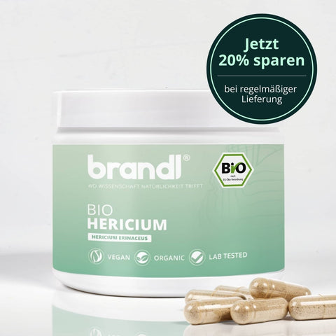 Weiße zylindrische dose mit mintgrünem label und brandl logo für bio hericium kapseln lions mane vegan organic