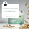 Ein grüner und weißer zylinderförmiger behälter bio hericium kapseln vegan organisch labortest bio hericium kapseln lions mane