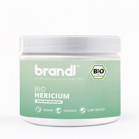 Bio hericium kapseln lions mane in einem weißen glas mit mintgrünem etikett von brandl