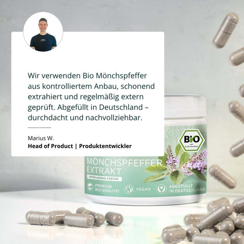 Ein zylindrischer behälter mit bio mönchspfeffer extrakt in grauen kapseln und grün-weißem etikett mit lila blüten
