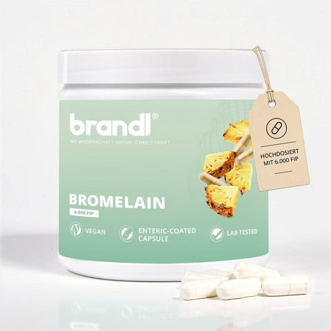 Weißer zylinderförmiger behälter der marke brandl bromelain kapseln mit mintgrünem etikett und beigem anhänger