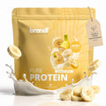 Eine goldgelbe packung pure protein 2.0 whey von brandl mit bananentraummotiv und bananenscheiben darauf