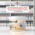 Vitamin d3/k2 kapseln von brandi in einem weißen glas mit orangefarbenem etikett und kristallmotiv