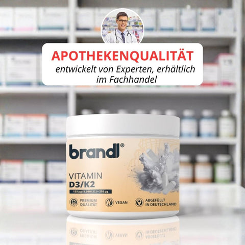 Vitamin d3/k2 kapseln von brandi in einem weißen glas mit orangefarbenem etikett und kristallmotiv